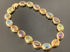 585' stamped yellow gold bracelet with mounted stones (colours red, blue, yellow, green and purple)