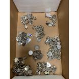 Various silver charm bracelets with assay stamps - together with a variety of charms - some stamped