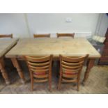 Rectangular Pine Farmhouse Table 150 x 85cm with protective glass cover and 4 ladderback chairs.