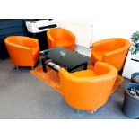 4 x Orange tub chairs & glass top coffee table