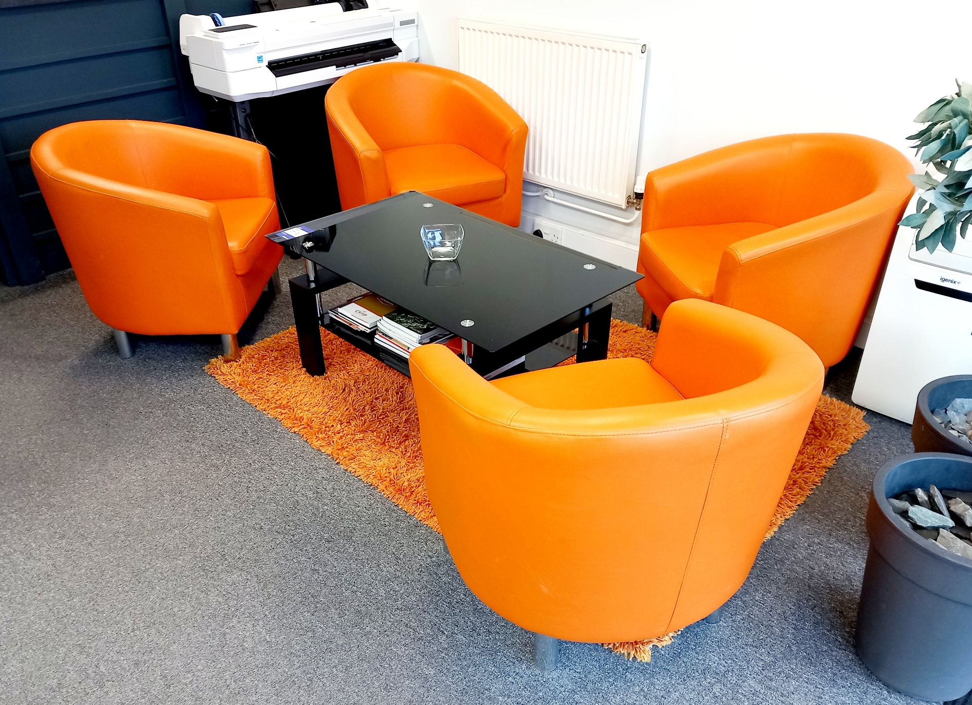 4 x Orange tub chairs & glass top coffee table