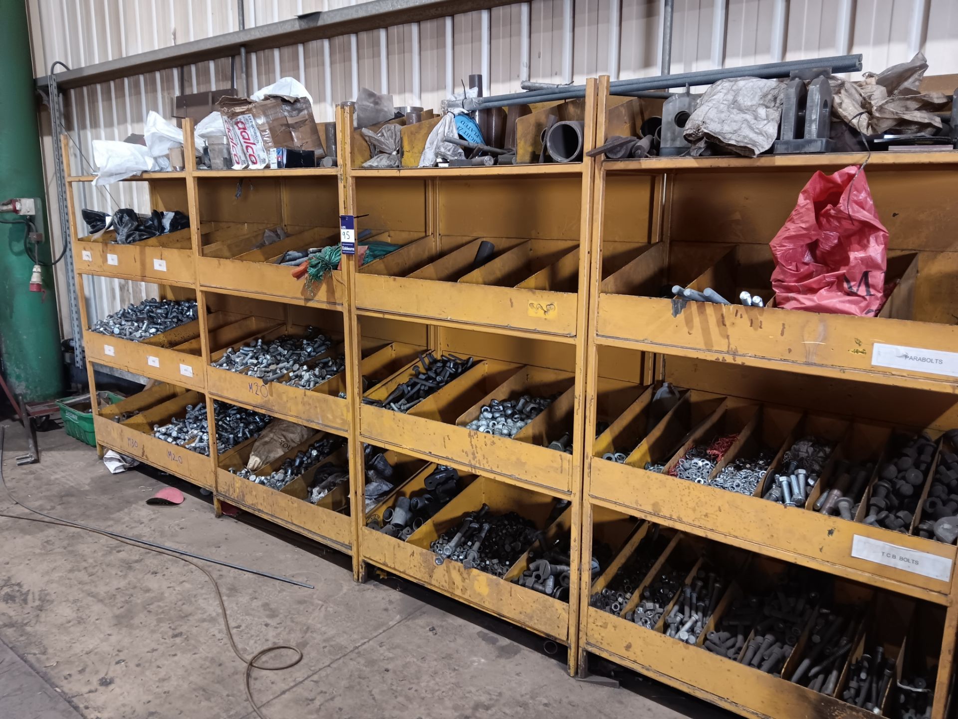 4 x Steel four tier shelving units with large quantity of bolts, nuts, threaded bar, washers,