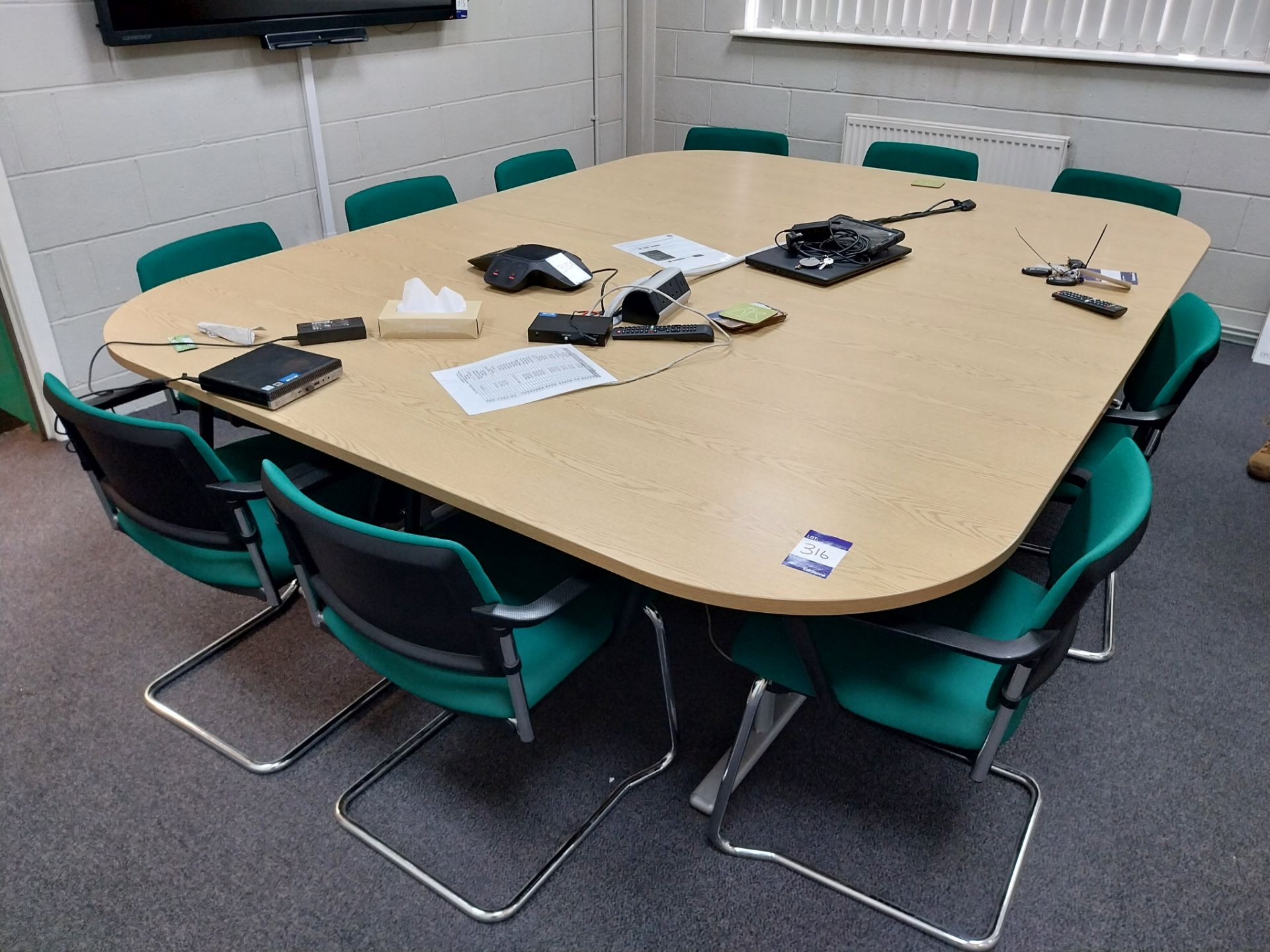 2 Part boardroom table with 12 upholstered and chrome legged chairs and bookshelf 2600mm x 2000mm