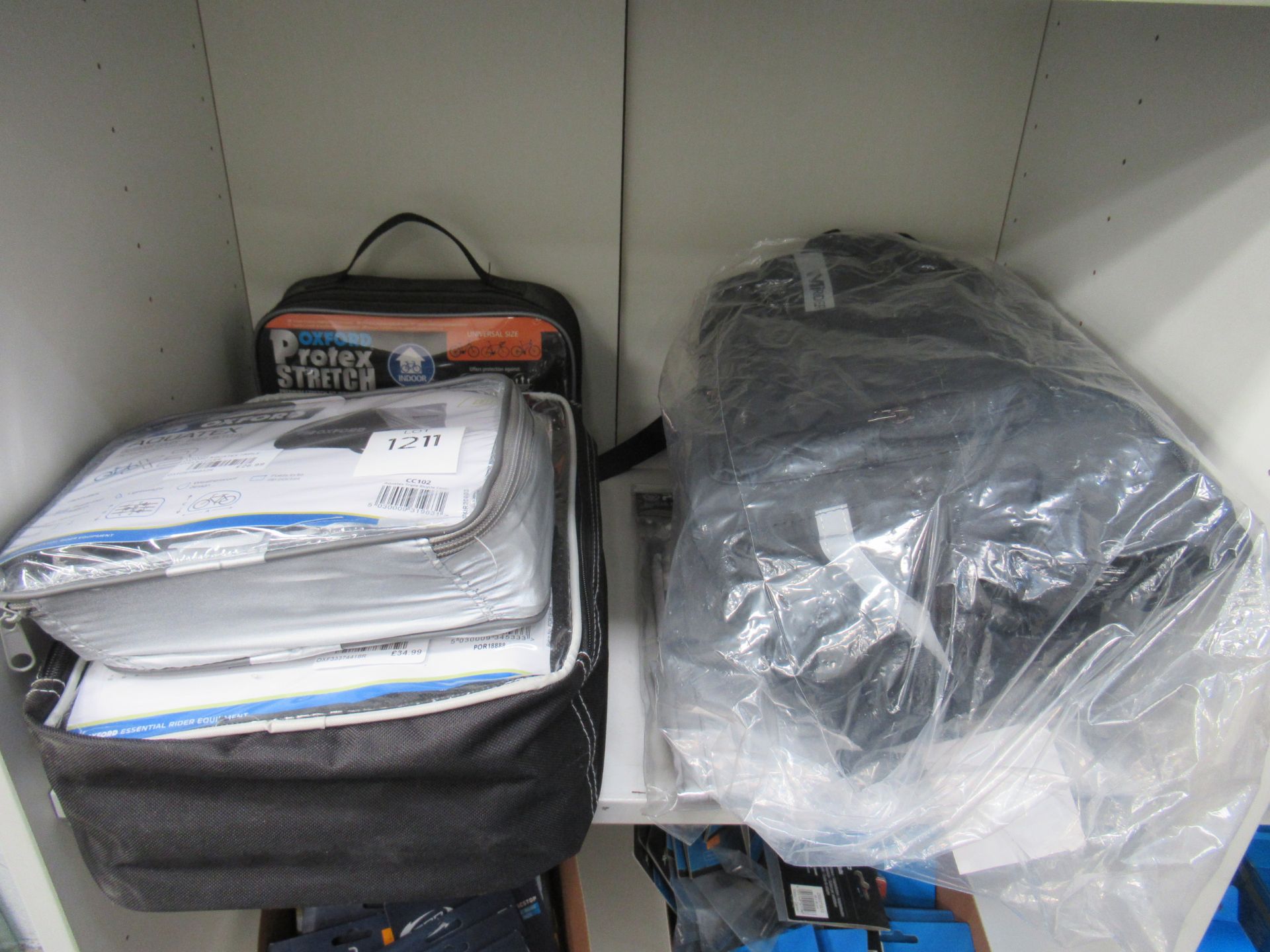 Shelf of protective covers for bikes and bags together with a MiRider pannier bag