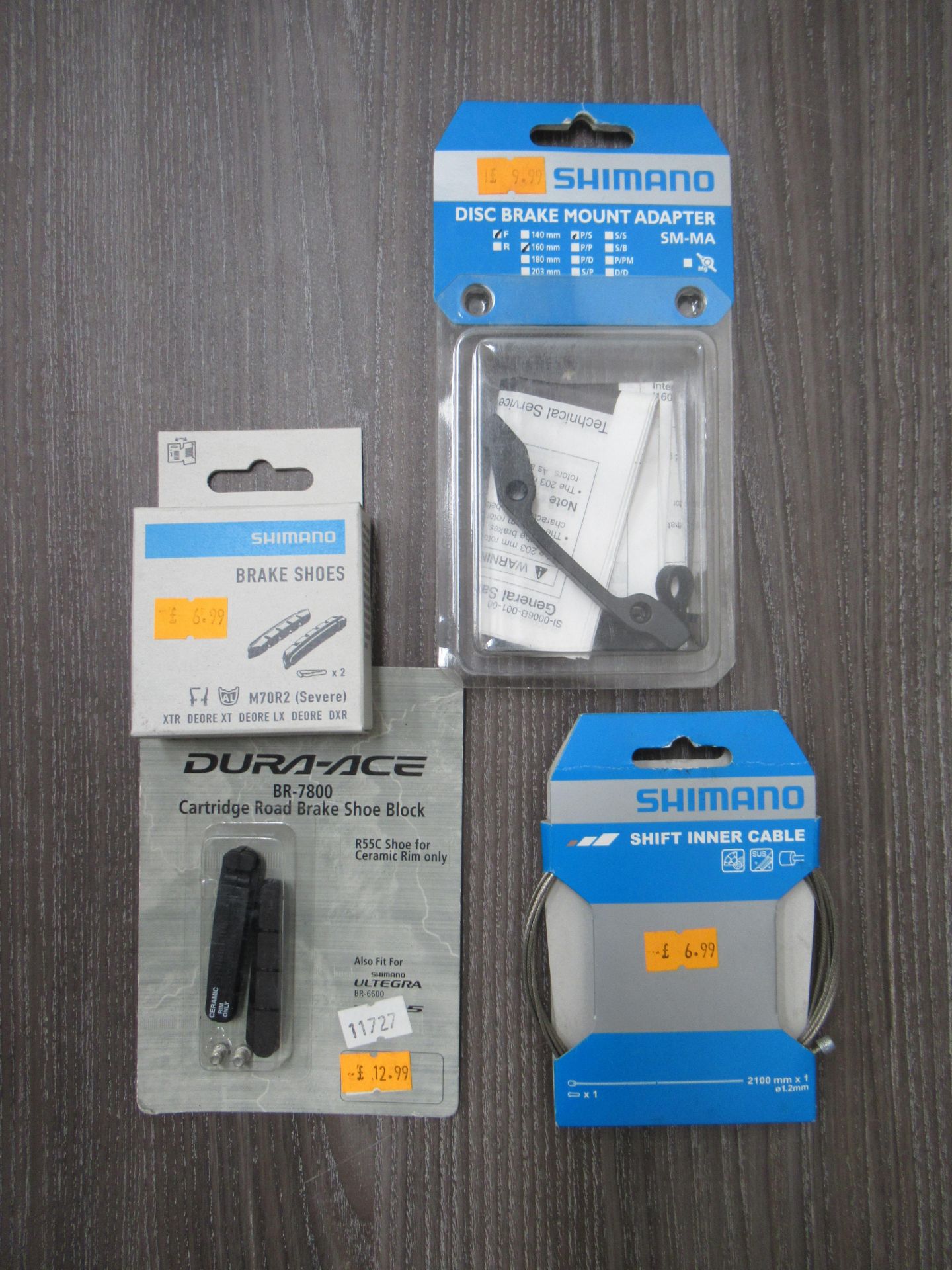Box of Shimano cycling accessories to include disc brake shoes; disc brake adapters; disc brake moun - Image 2 of 2