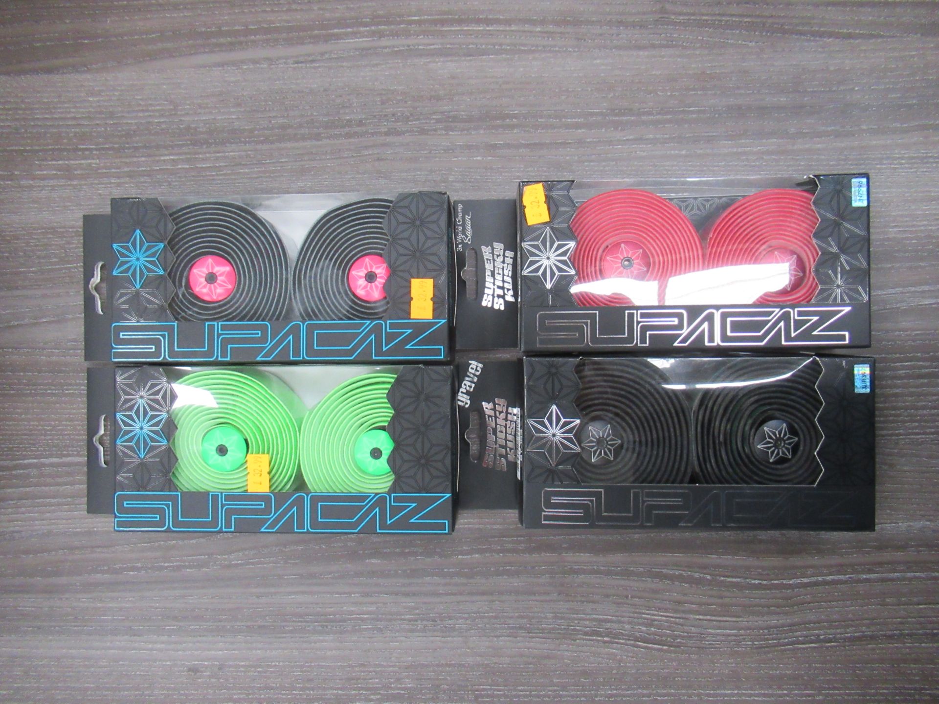 Box of Supacaz handlebar tape in Red, Camo, Neon Green and Neon Pink Galaxy (RRP£32.99 each) - Image 2 of 2