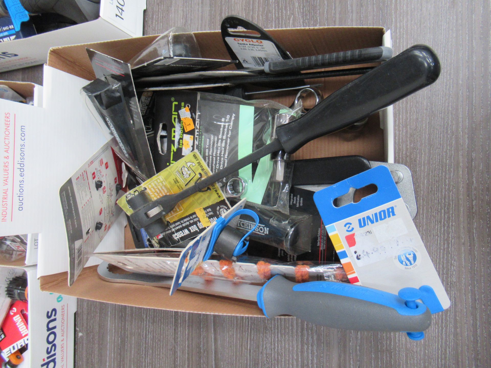 Box of assorted cycling tools including spanner's, box wrenches etc.