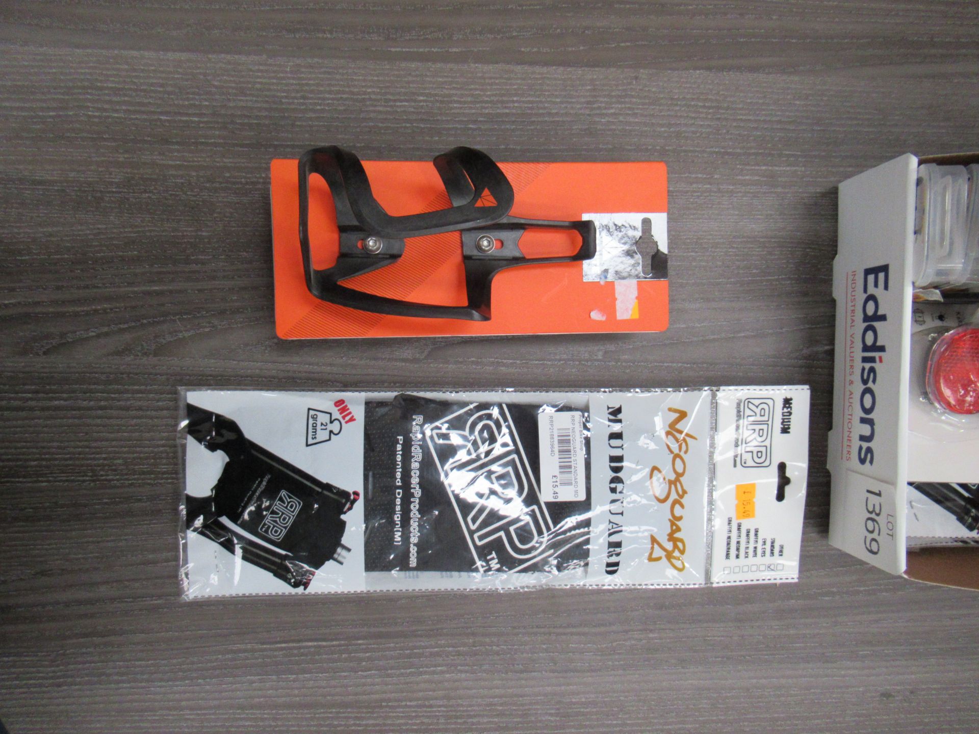 Box of cycling accessories to include cycling lights; bottle cages; road cleatsfork mudguards etc. - Image 2 of 3