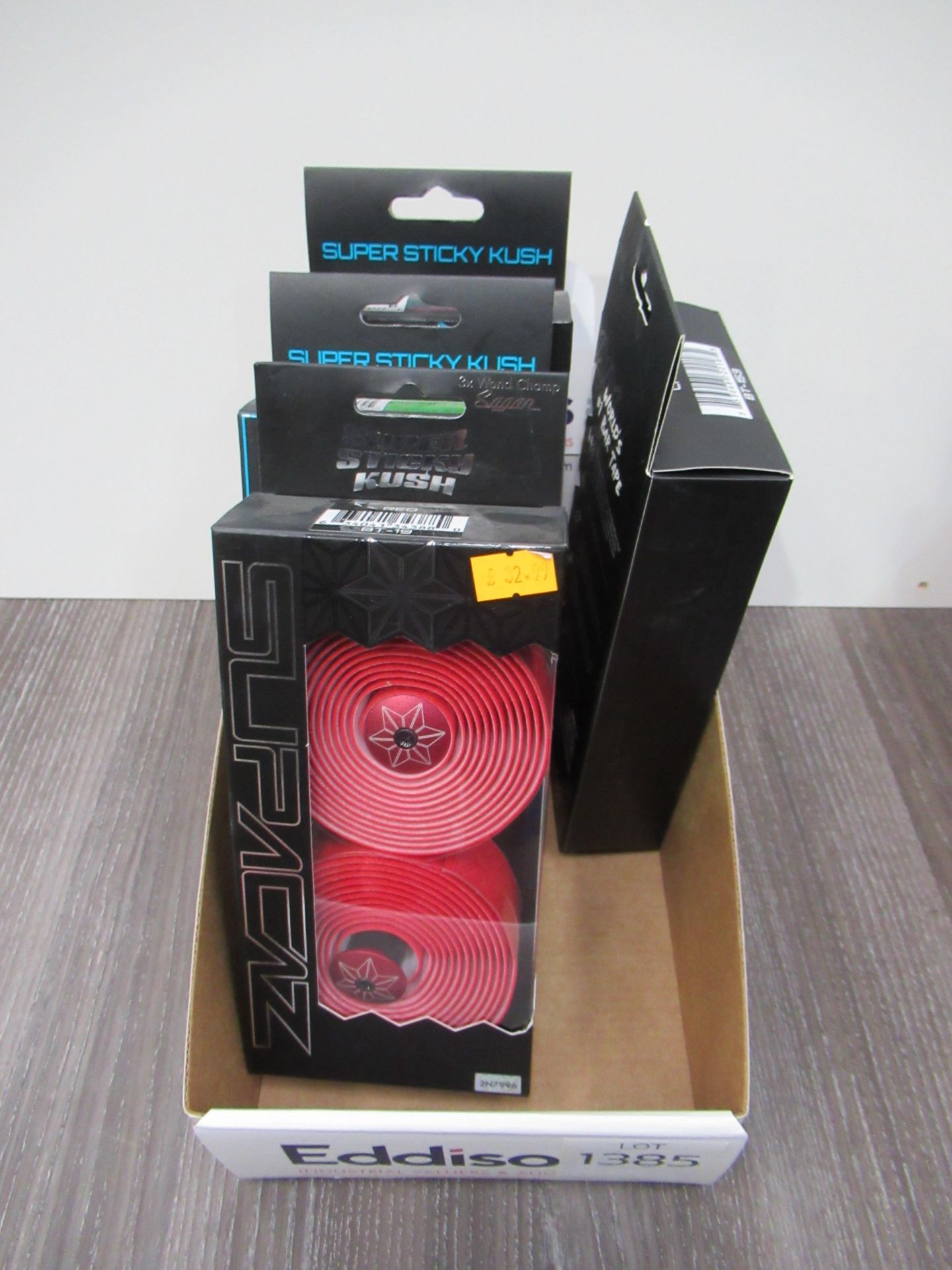 Box of Supacaz handlebar tape in Red, Camo, Neon Green and Neon Pink Galaxy (RRP£32.99 each)