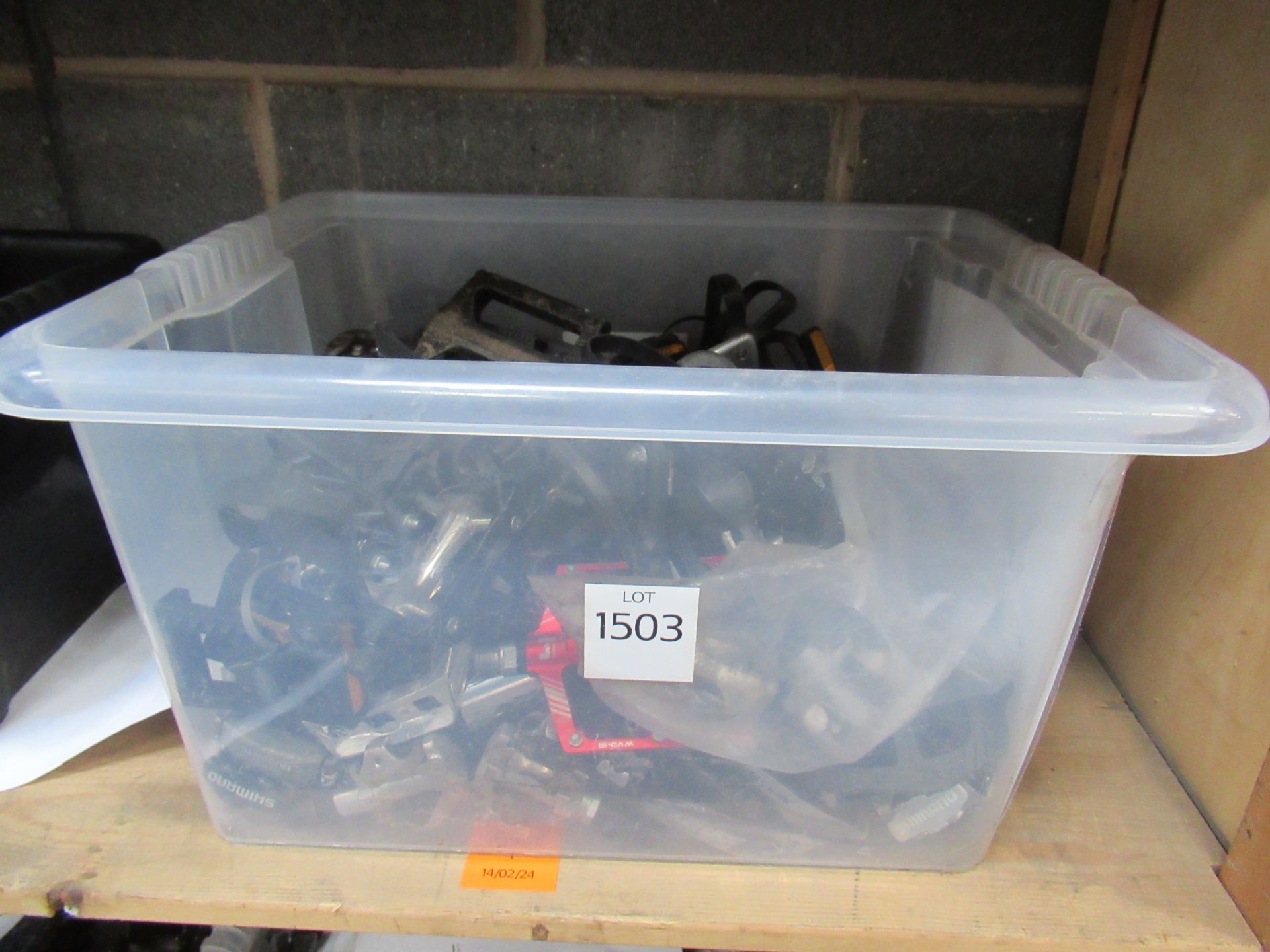 Box of used cycling pedals