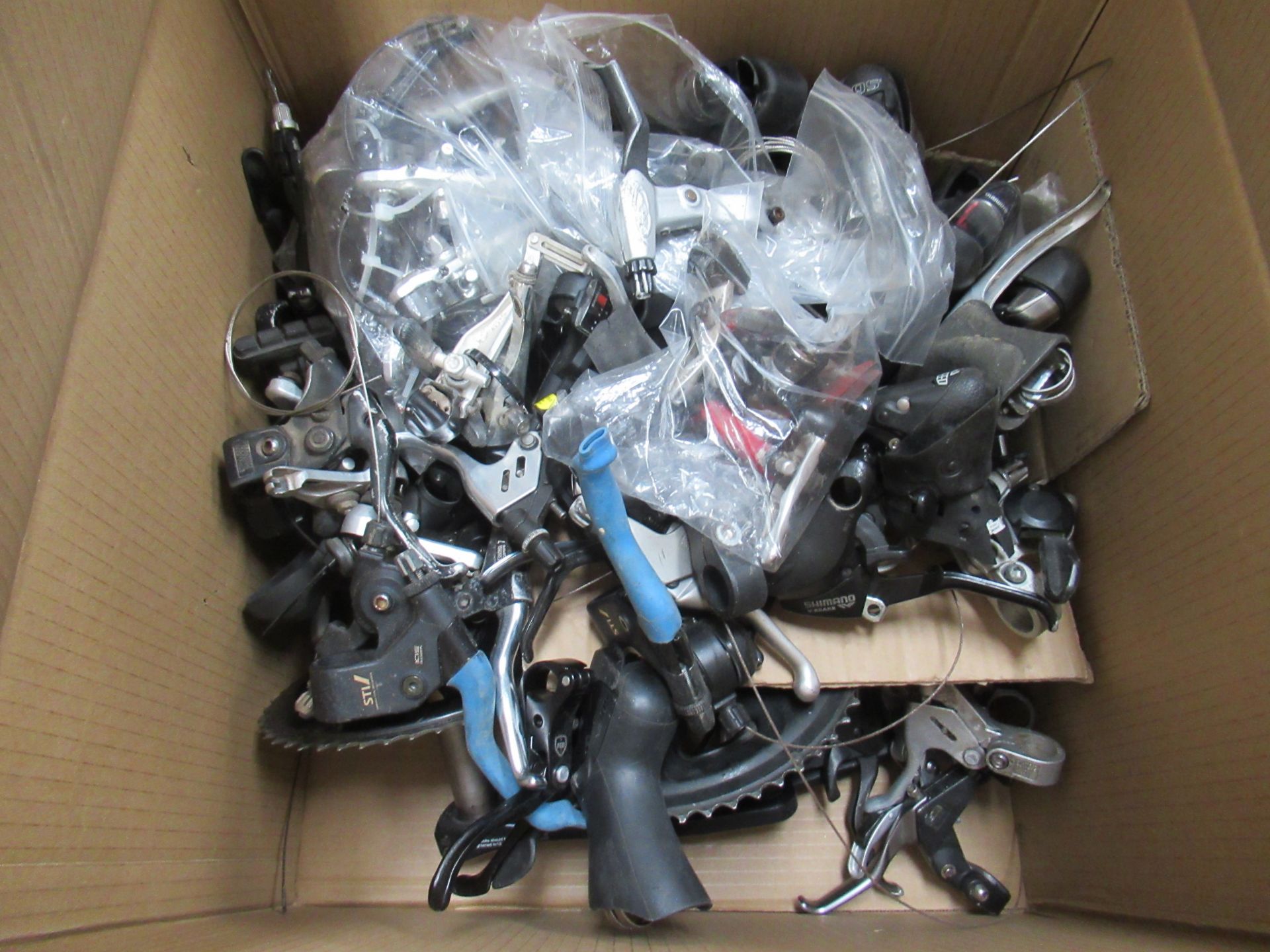 Contents of box including assorted used cycling parts and accessories - Image 2 of 2