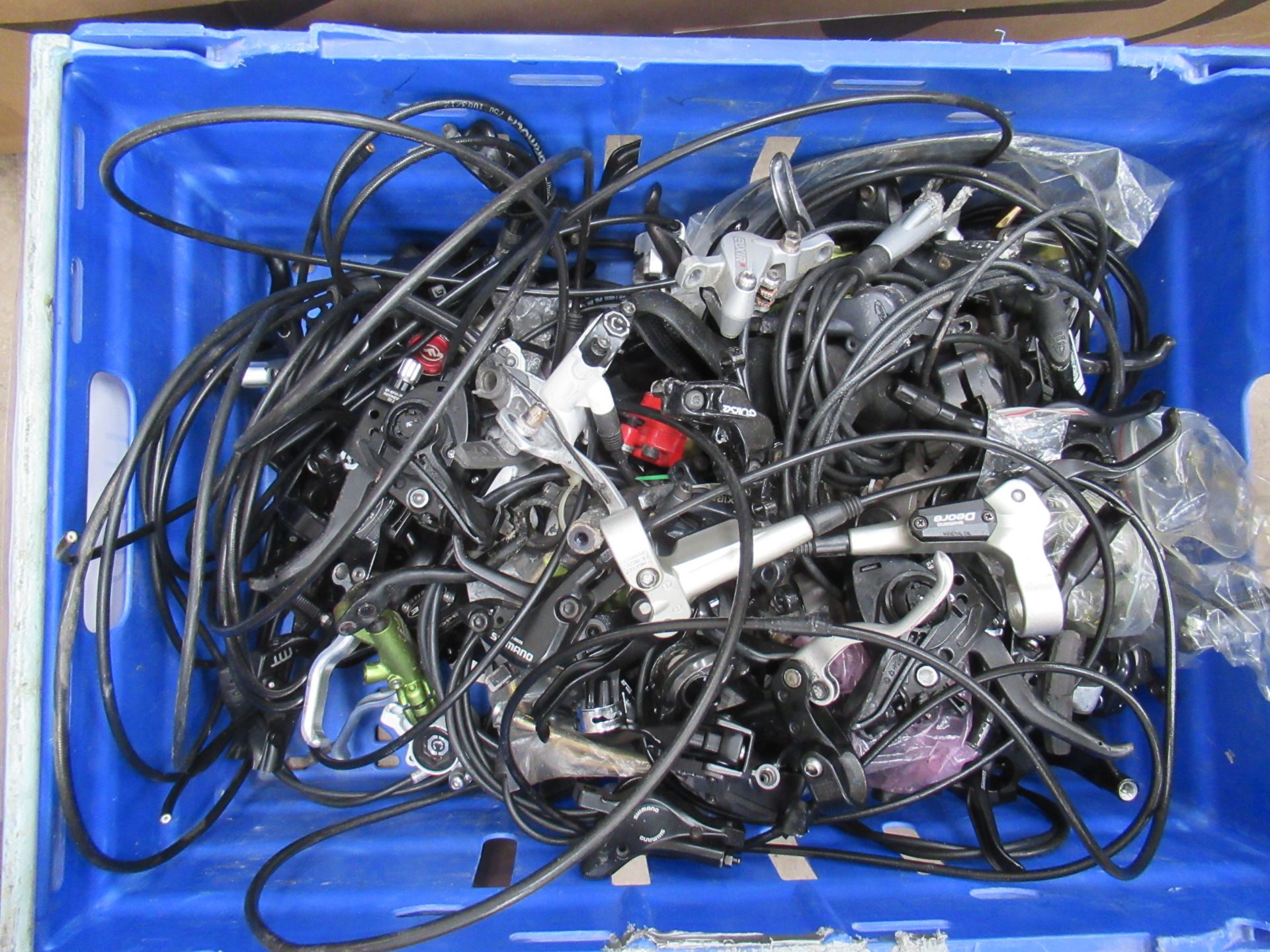 Contents of box including used hydraulic brake systems