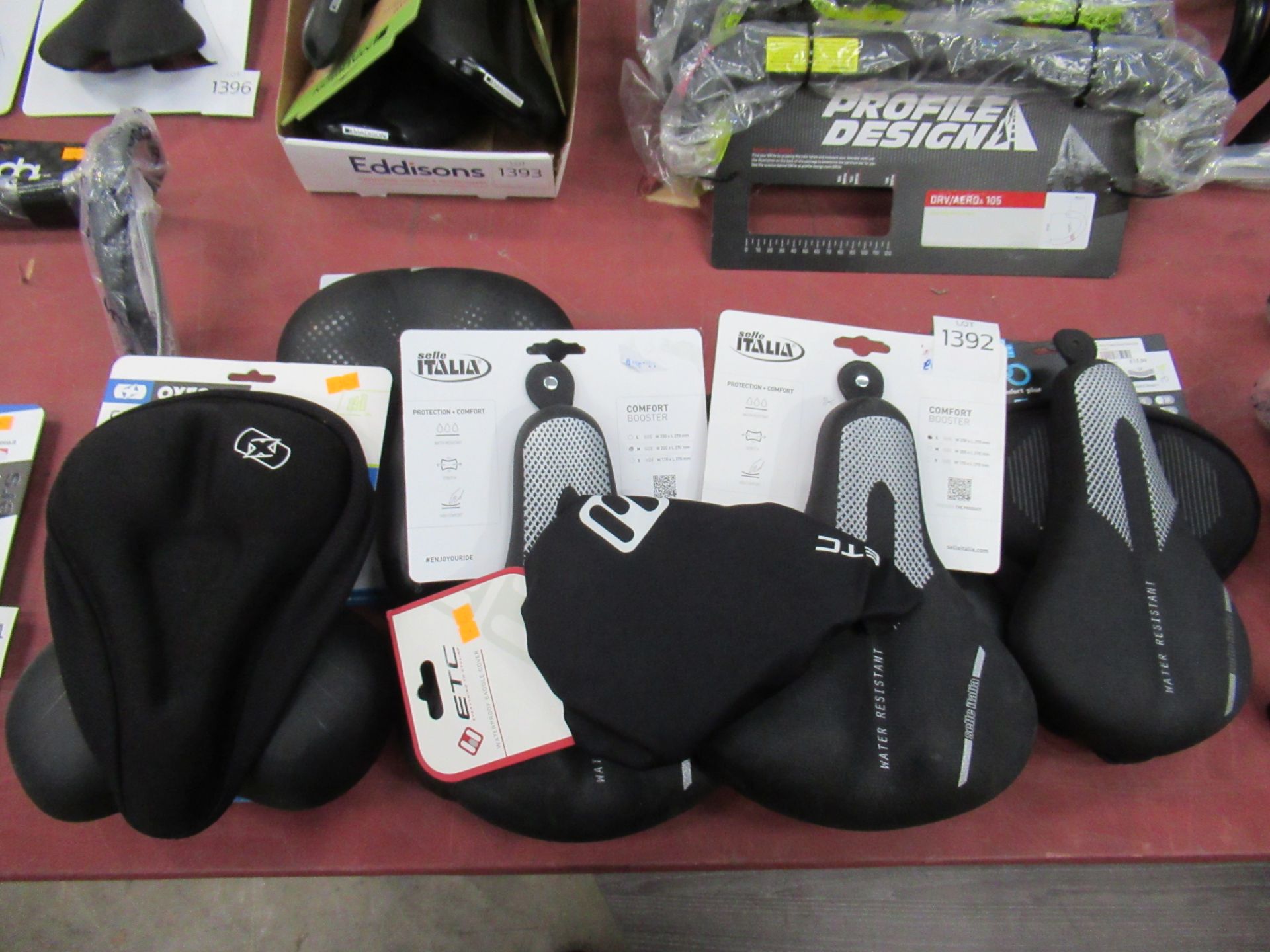 Assorted saddles and saddle covers/booster from Selle Italia, DDK, Oxford etc.