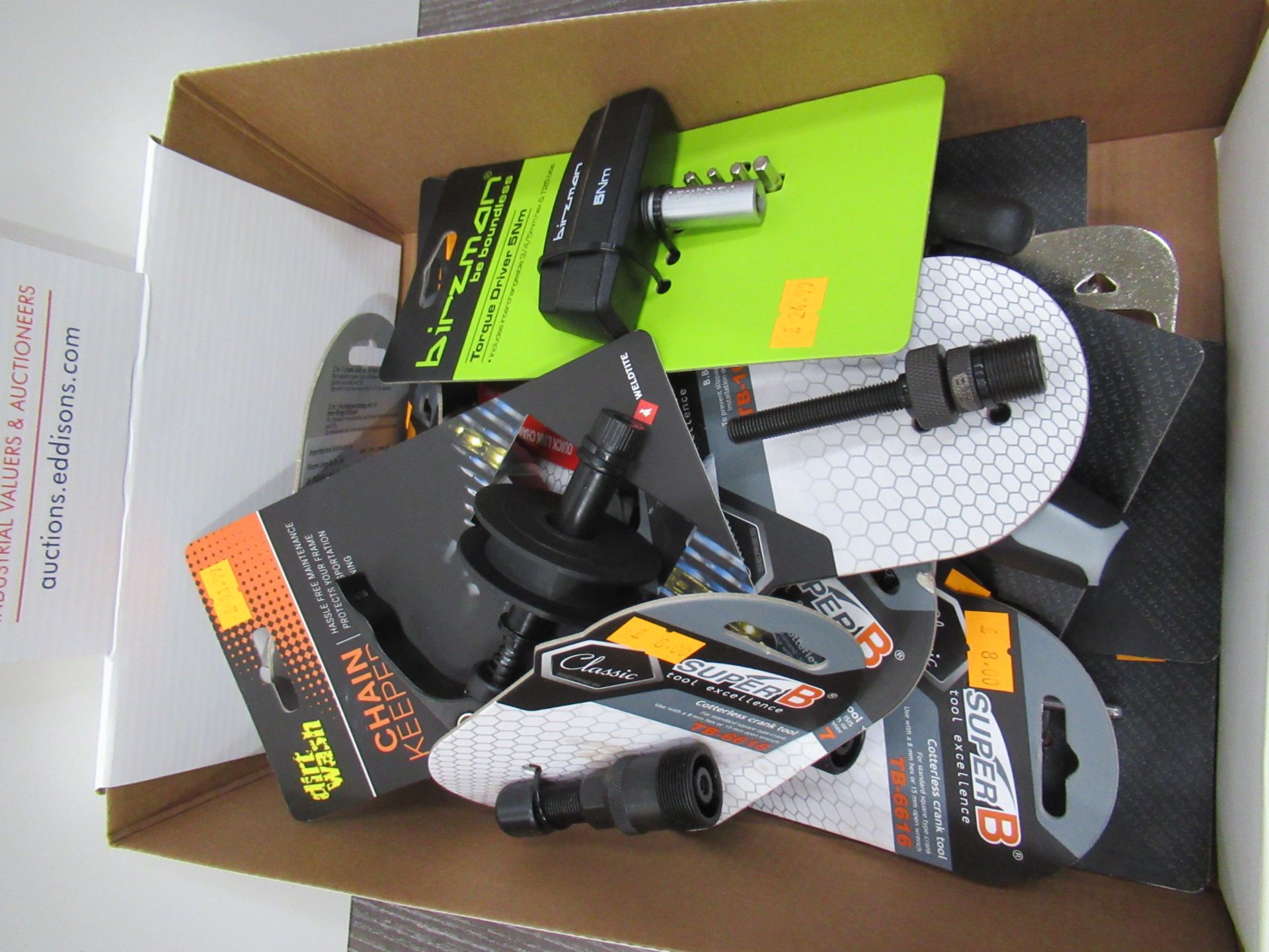 Box of assorted cycling tools including chain keepers; cotterless crank tool; torque driver etc.