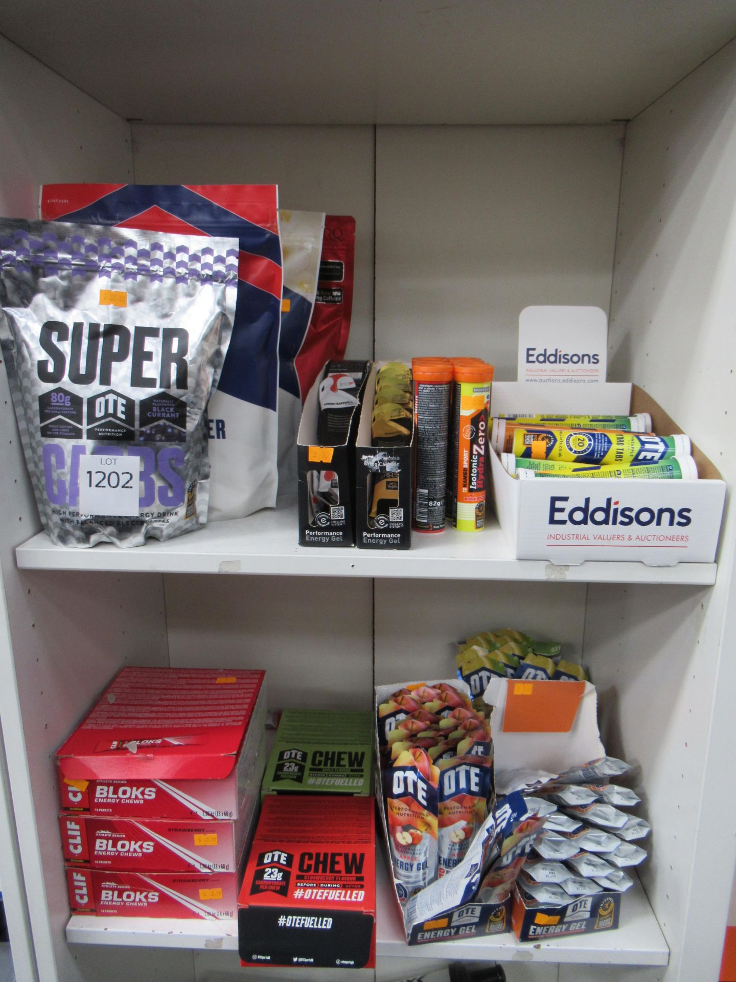 2 x shelves of assorted supplements and nutrition aids to include OTE carb boosters and energy drink