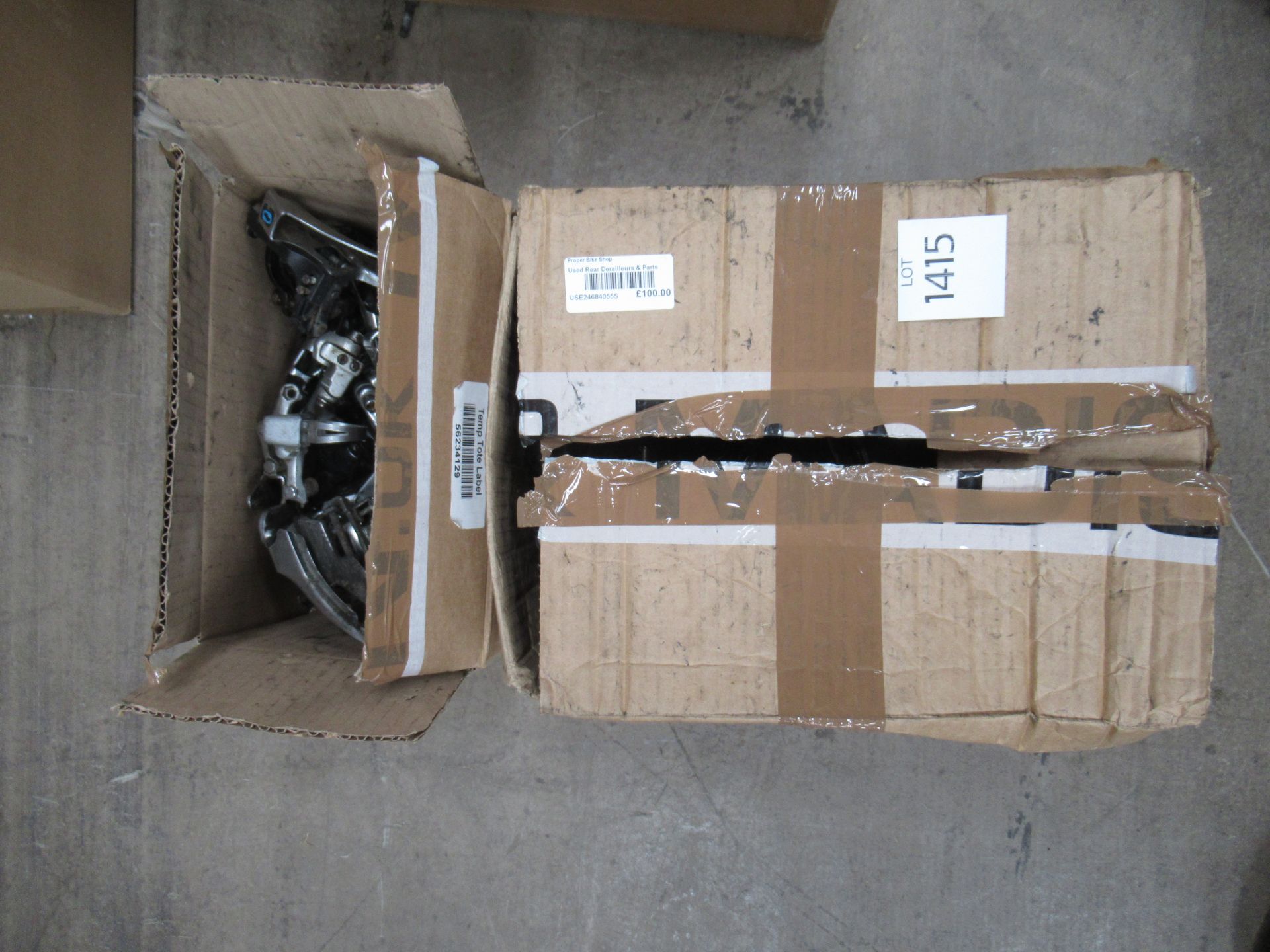 Box containing used front and rear derailleurs