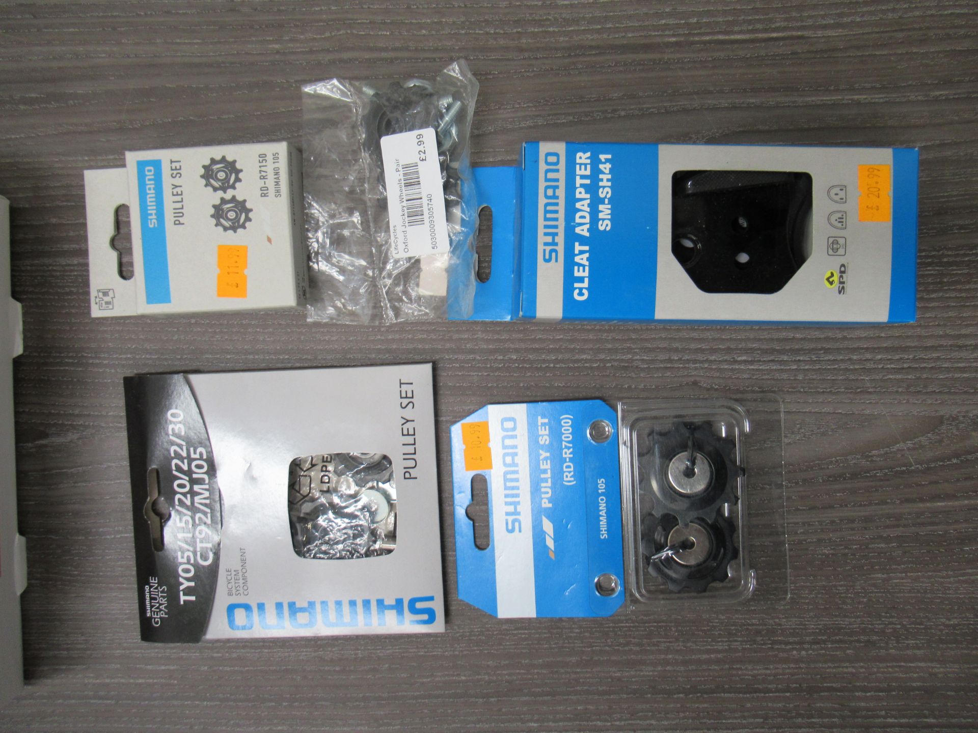 Box of Shimano cycling accessories to include RD-7000 pulley sets; RD-8000 pulley sets; Cleat Adapte - Image 2 of 2