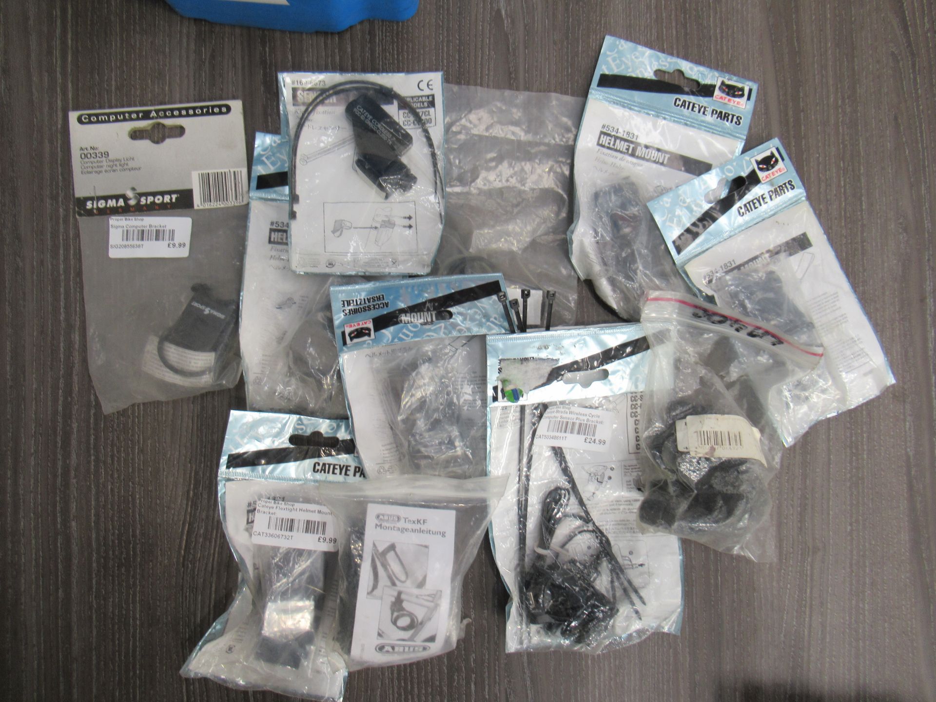 Contents of box featuring a selection of Cateye accessories such as computer sensors, helmet mounts - Image 4 of 5