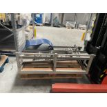 300 mm wide product shelf with rail. 4 legs. 1200 x 650 mm. Stainless Steel. Please note this lot is