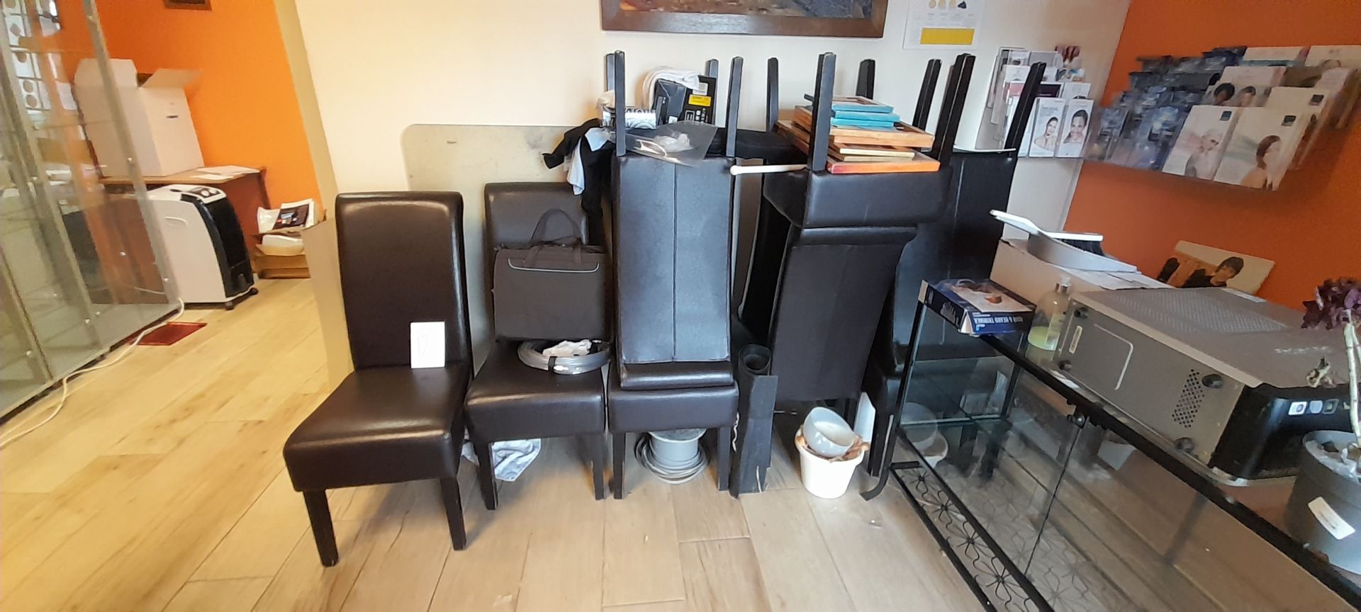 8 x Brown faux leather dining chairs, contents excluded