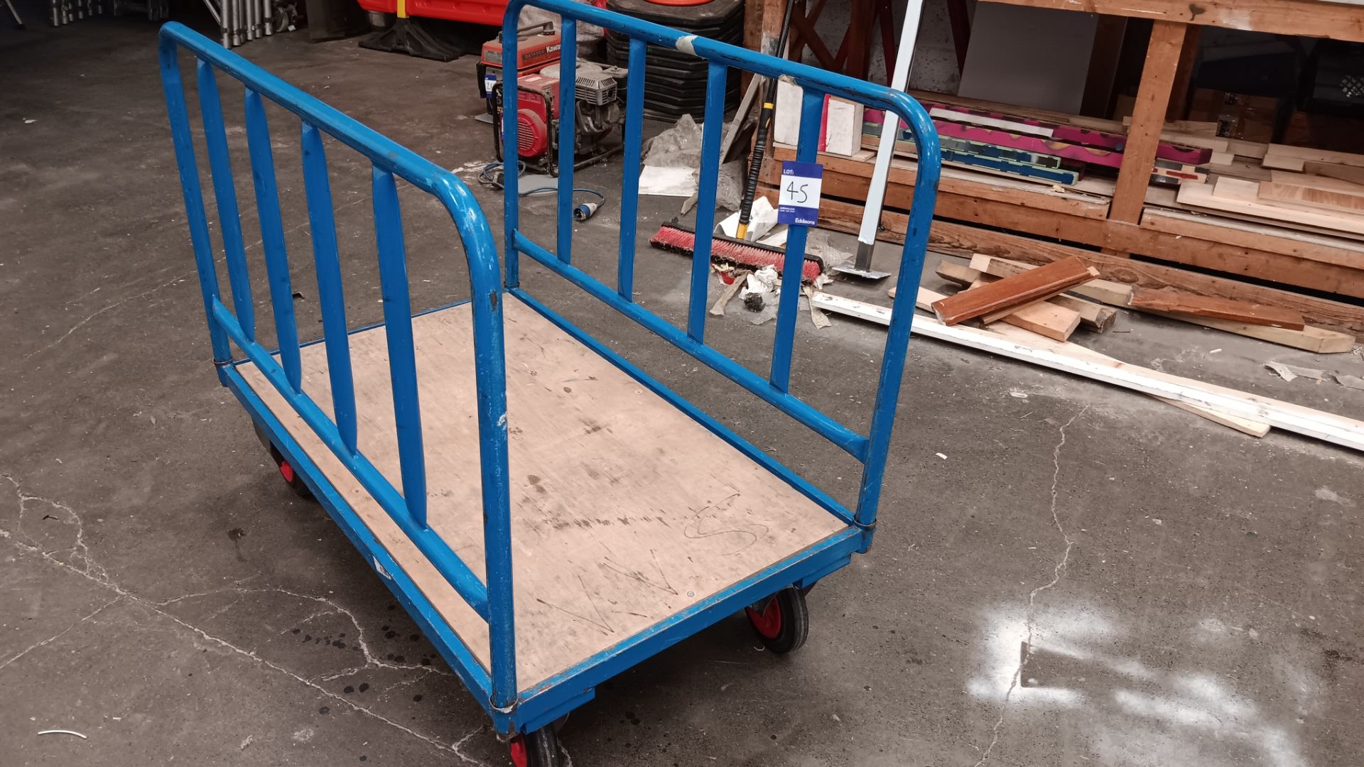 2 sided platform truck with plywood base – Located in Unit 3