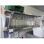 2 x Stainless steel shelves and contents of bottles and jugs