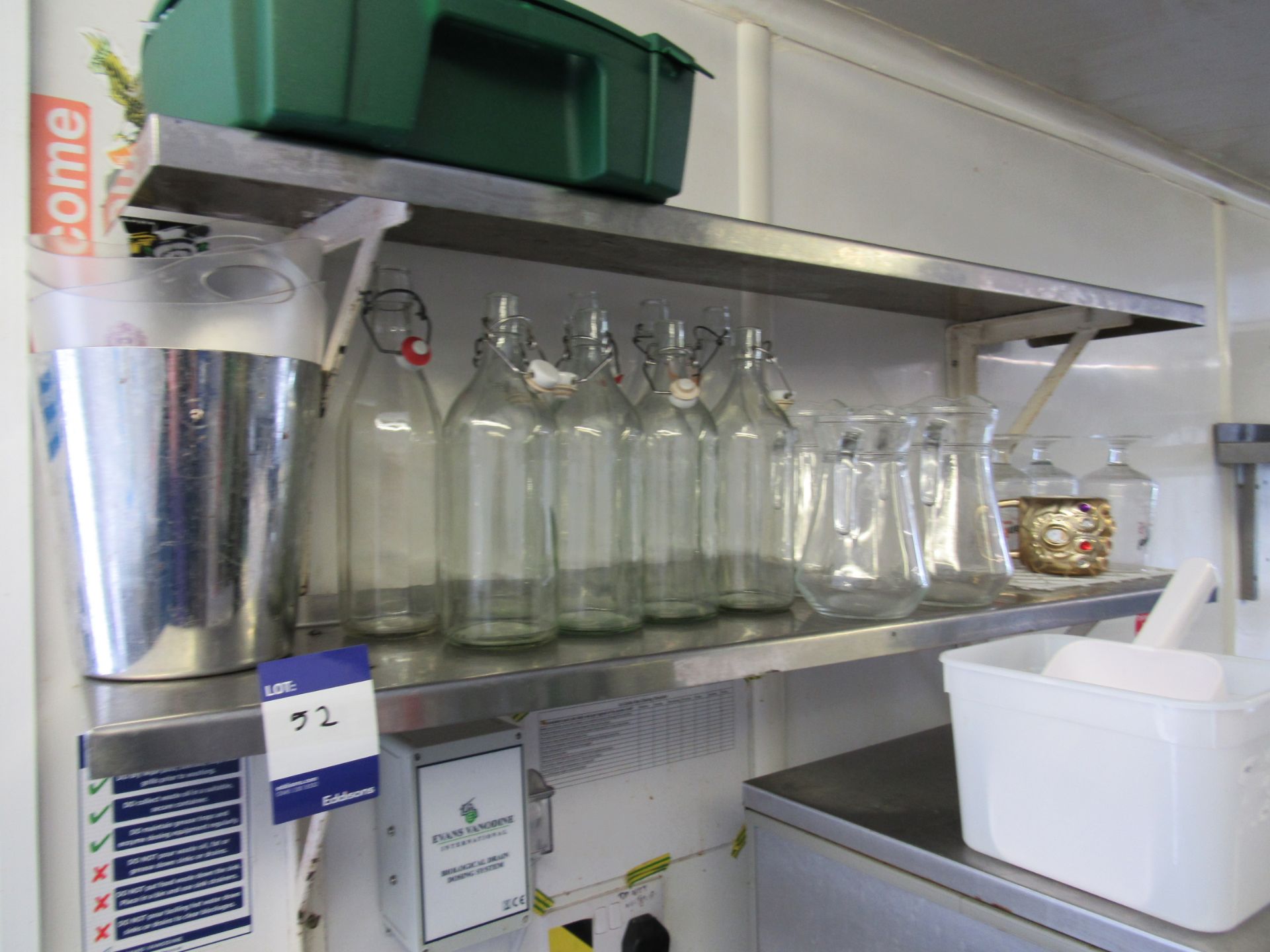 2 x Stainless steel shelves and contents of bottles and jugs