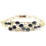 Bracelet with 12x blue Sapphires and Diamonds 14K Yellow Gold