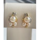 Beautiful vintage earrings with pearls and diamonds.Pearls have a nice color and hue. Biggest