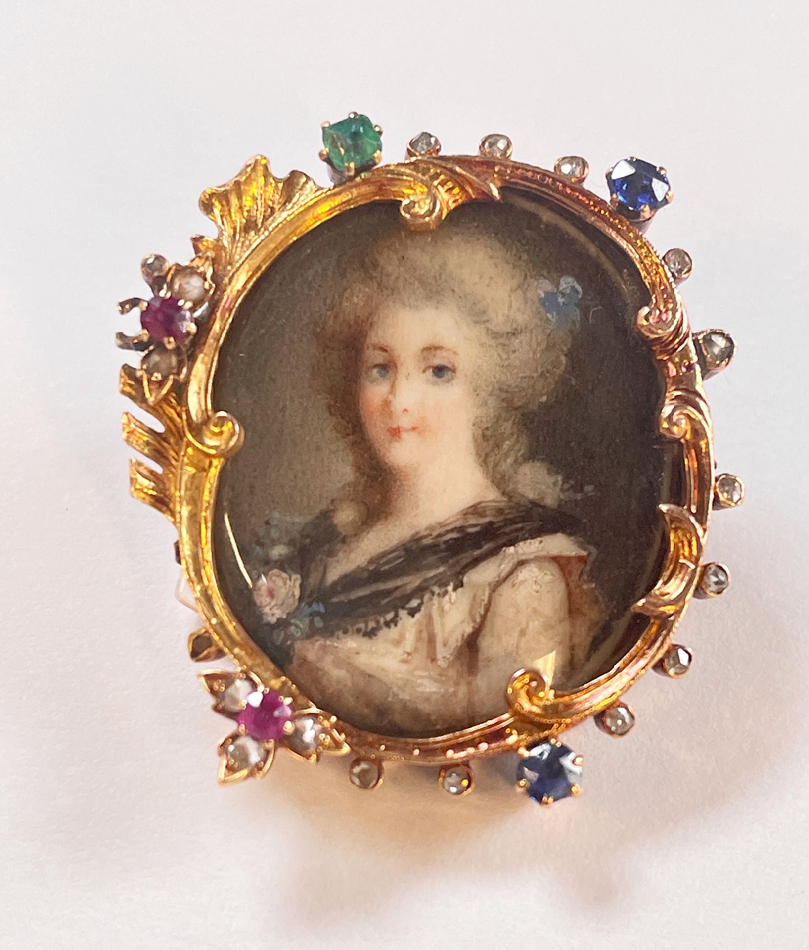 Antique French brooch with miniature painting. From approximately 1850-1870. A young lady dressed in