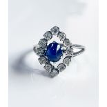 Diamond ring 18K White Gold in the middle a sapphire