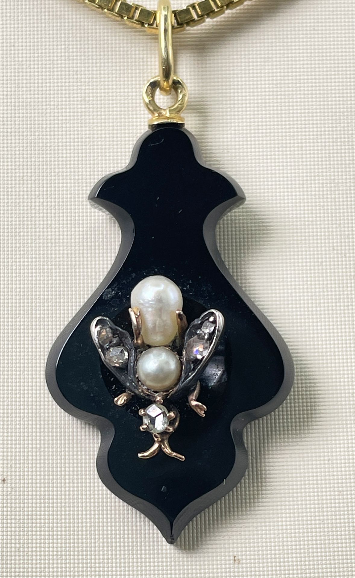 Antique onyx pendant, with 14K gold insect, pearls and diamonds