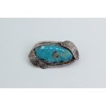 Silver brooch with a large turquoise. Indian jewelry USA