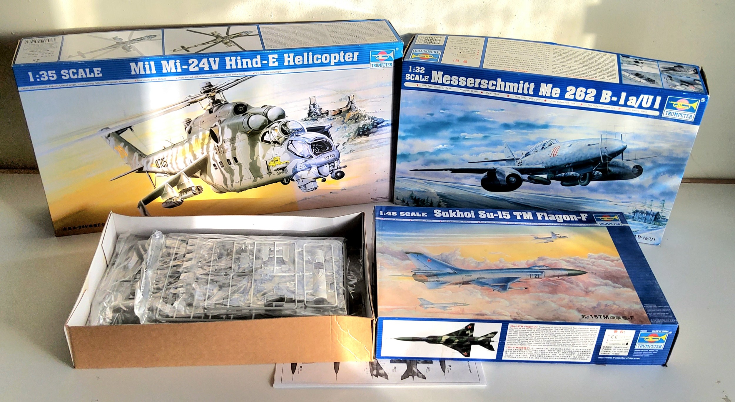 Three Boxed Trumpeter Model Aircraft Kits, to include 05103 1/35 Mil Mi-24V Hind-E Helicopter, 02237