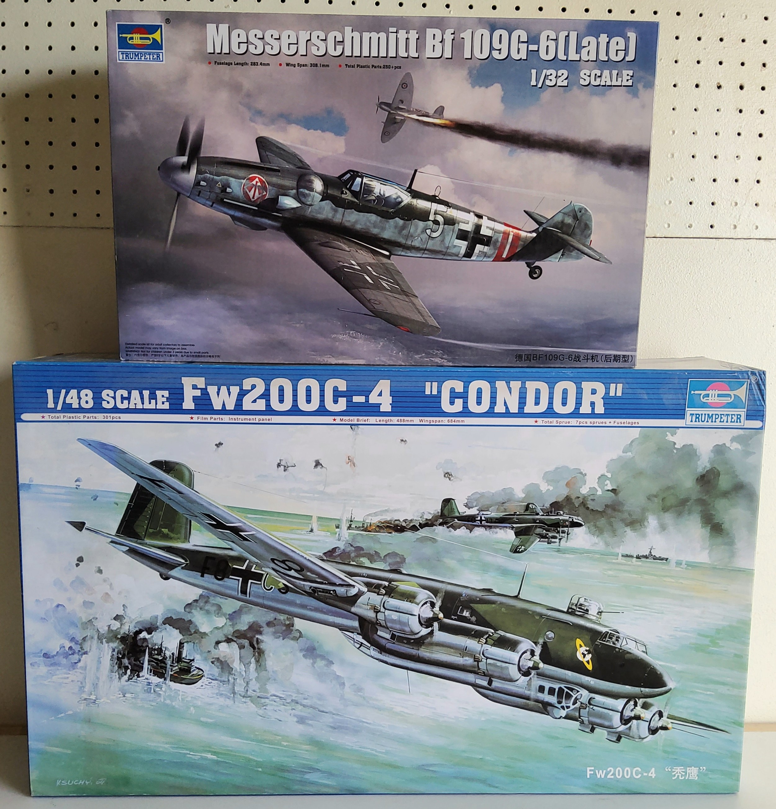 A boxed Trumpeter 02814 Fw200C-4 "Condor" Model Kit; a 02297 Messerschmitt Bf109G, both unchecked