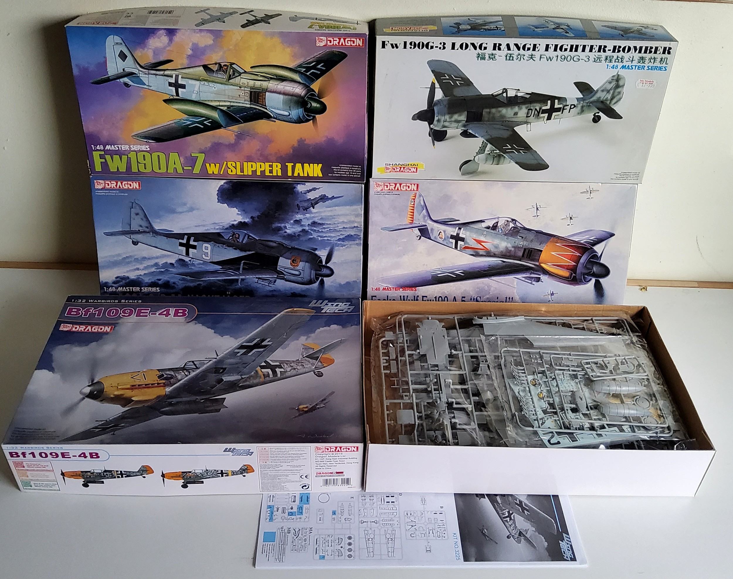 Five boxed Dragon 1/48 scale Luftwaffe aircraft kits; #3225 BF109E-4B, #5506 Fw190A-5, #5545