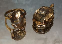 A 9ct gold cocktail ring claw set with an oval light smokey topaz 18 x 13mm, size N, 5g gross; a 9ct