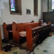 The left hand Victorian pitch pine choir stall from Dore Church, including pierced fretwork hymn