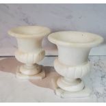 A pair of Italian alabaster miniature campana shaped vases, canted square bases, 8cm high