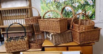 A collection of farmhouse wicker baskets including picnic hamper, wine basket, etc
