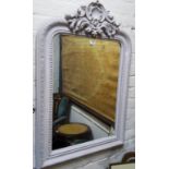 An early 20th century carved mirror with pierced shell capped super structure, painted, 99cm x 67cm