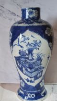 A large 19th century Chinese ovoid vase, decorated in underglaze blue with vase and precious