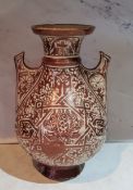 A Hispano-Moresque copper lustre two handled vase, 22.5cm high