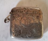 A Victorian bowed rectangular vesta case, engraved and chased with foliate scrolls, 5cm high,