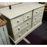 A pair of contemporary white chests, of two short over two long drawers, 79cm high,  67cm wide