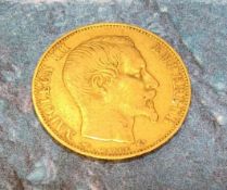 A Napoleon III 20 Francs gold coin, dated 1857, plain head portrait of Napoleon III above BARRE, the