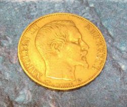 A Napoleon III 20 Francs gold coin, dated 1857, plain head portrait of Napoleon III above BARRE, the