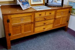 Gnomeman: A Thomas Whittaker (Littlebeck) English Oak sideboard, the rectangular top over a bank