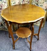 An early 20th century 'pie crust' shaped circular occasional table, cabriole legs, shaped undertier,