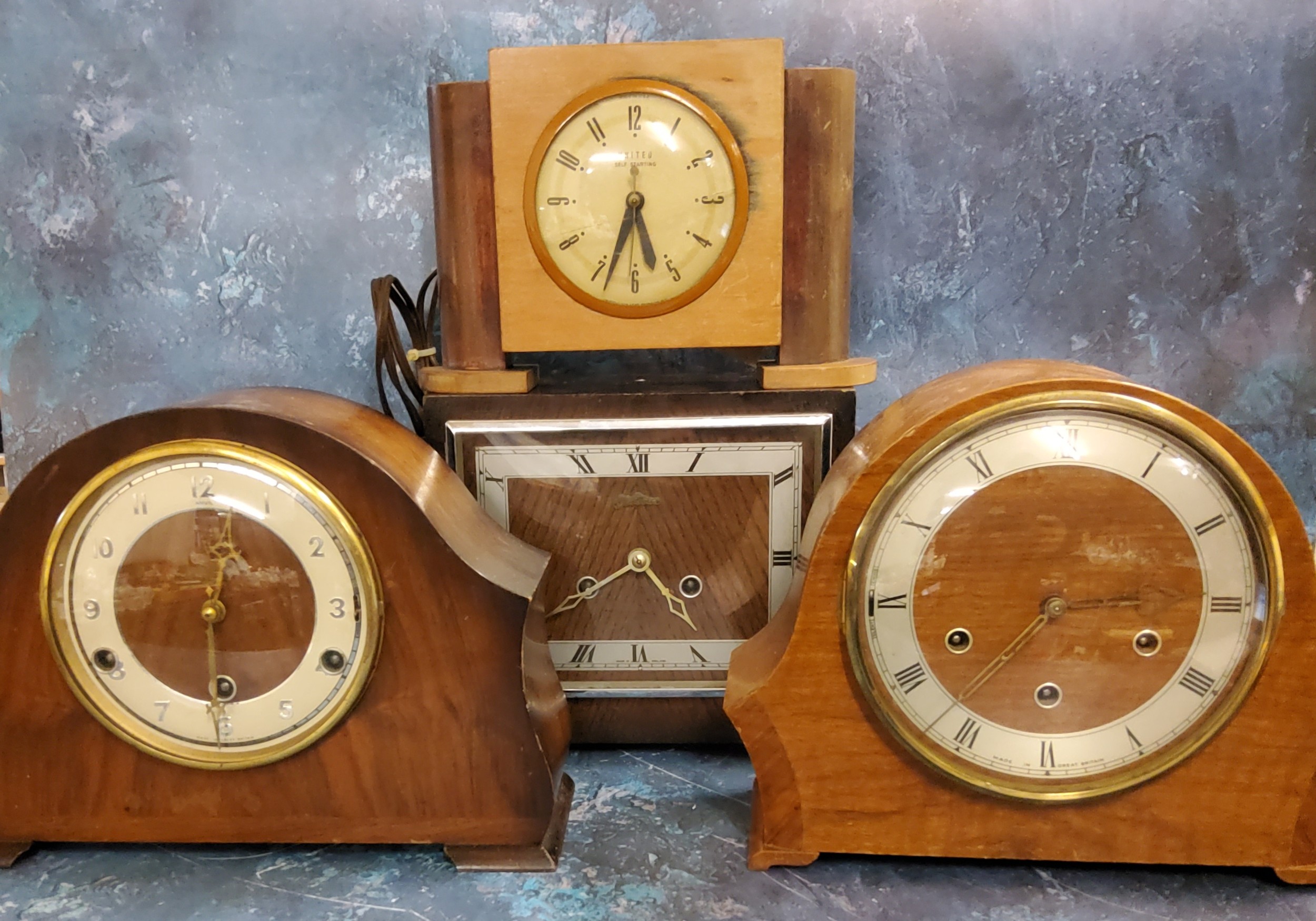 An Art Deco oak mantel clock, twin winding holes, c.1930;  others (4)